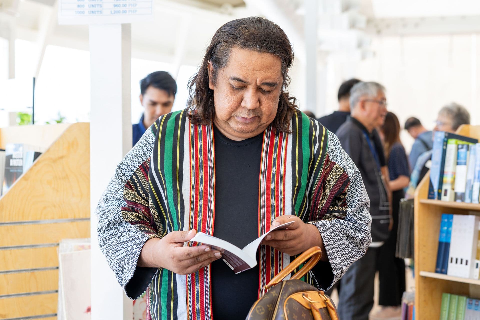 Subic Bay, Philippines :: Guest browses through books after the opening ceremony.